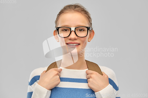 Image of smiling teenage student girl with school bag