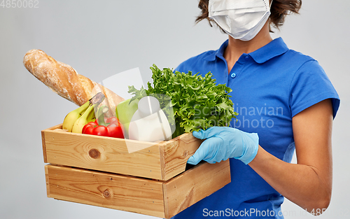 Image of delivery woman in face mask with food in box