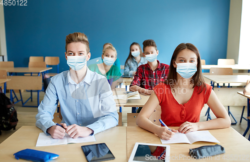 Image of group of students in masks at school lesson