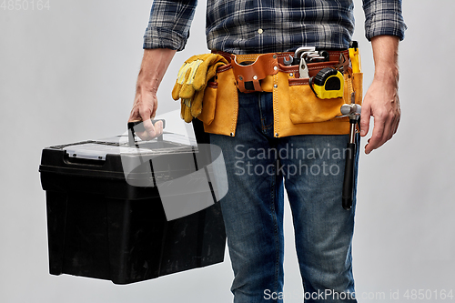 Image of male builder with box of working tools