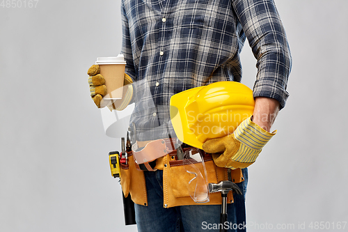 Image of male builder with coffee, helmet and working tools