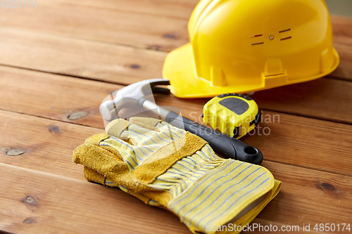 Image of different work tools on wooden boards