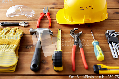 Image of different work tools on wooden boards