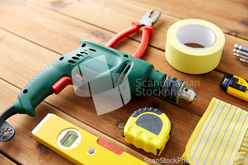 Image of different work tools on wooden boards