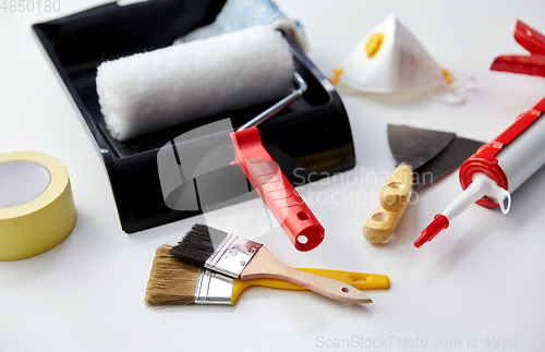 Image of different painting work tools on white background