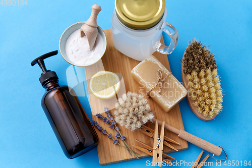 Image of washing soda, soap, brushes, lemon and clothespins