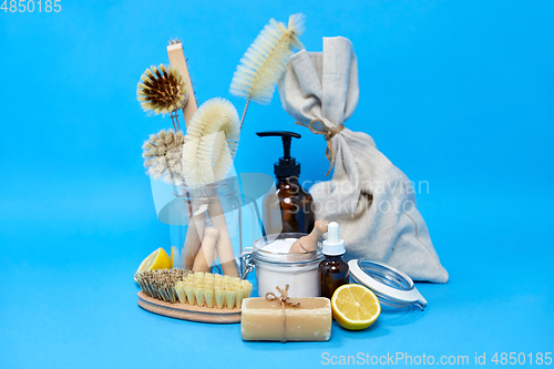 Image of lemons, soap, washing soda, vinegar and brushes