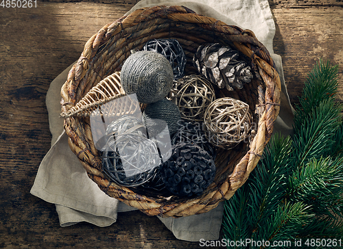 Image of Christmas decorations in a wicker basket