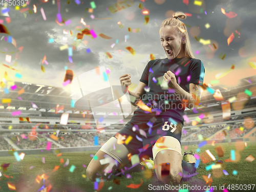 Image of Professional sportswoman caught in moment of winning and confetti flying, motion and action