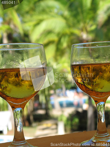 Image of beer glasses by the pool