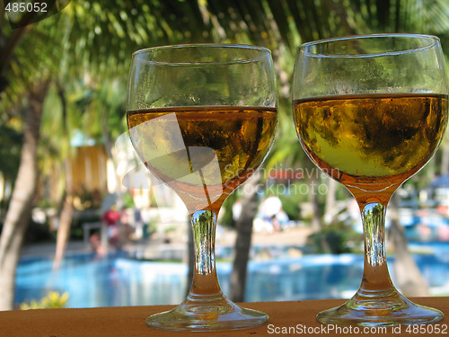 Image of beer glasses by the pool