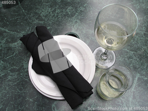 Image of table setting with wine