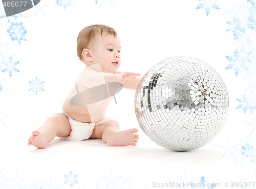 Image of adorable baby boy with big disco ball