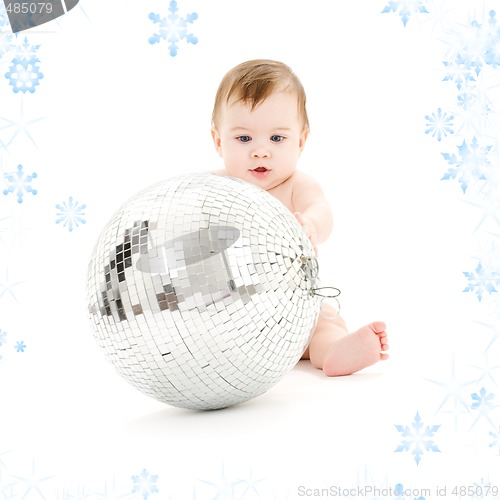 Image of adorable baby boy with big disco ball