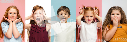 Image of Young and happy kids gesturing isolated on multicolored studio background. Human emotions, facial expression concept