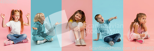 Image of Young and happy kids gesturing isolated on multicolored studio background. Human emotions, facial expression concept