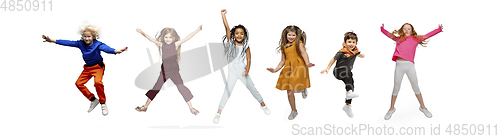 Image of Little and happy kids gesturing isolated on white studio background. Human emotions, facial expression concept