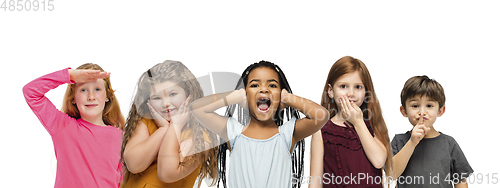 Image of Little and happy kids gesturing isolated on white studio background. Human emotions, facial expression concept