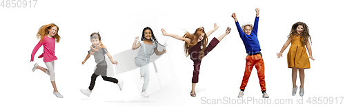 Image of Little and happy kids gesturing isolated on white studio background. Human emotions, facial expression concept