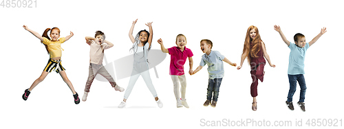 Image of Little and happy kids gesturing isolated on white studio background. Human emotions, facial expression concept