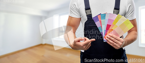 Image of close up of painter with color charts