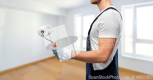 Image of close up of painter or builder with paint roller