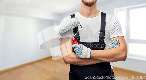 Image of close up of painter or builder with paint roller