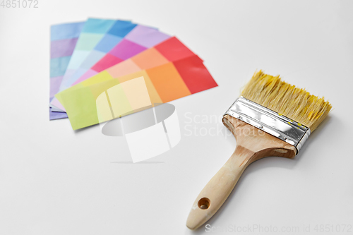 Image of paint brush and color palette on white background