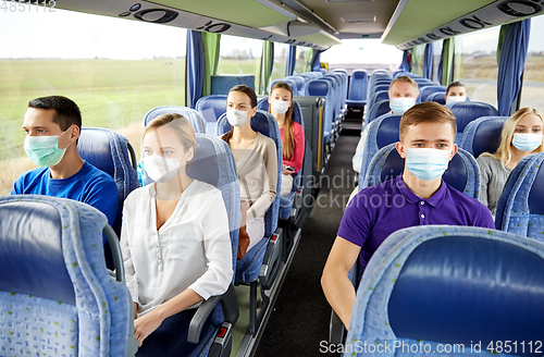 Image of passengers or tourists wearing masks in travel bus