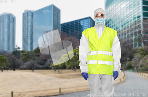 Image of healthcare or sanitation worker in hazmat suit