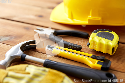 Image of different work tools on wooden boards