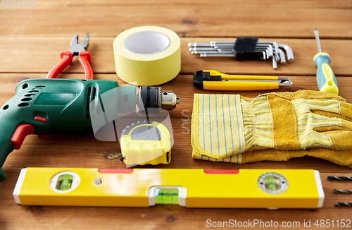 Image of different work tools on wooden boards