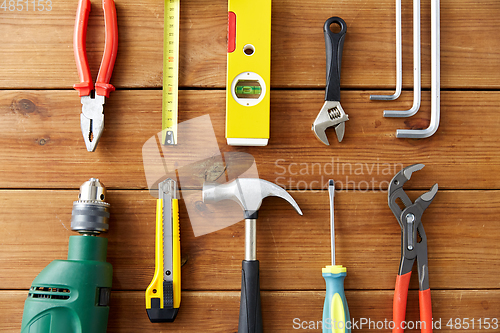 Image of different work tools on wooden boards