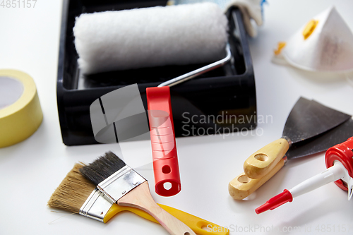 Image of different painting work tools on white background