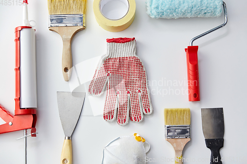 Image of different painting work tools on white background