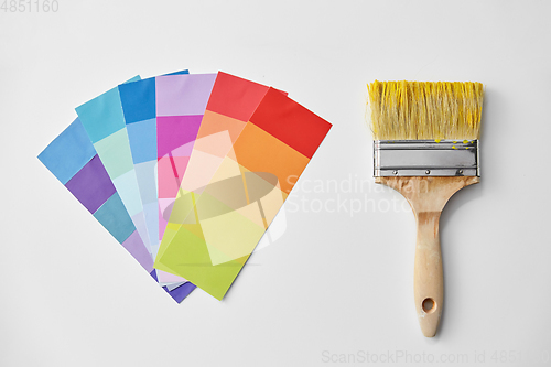 Image of paint brush and color palette on white background