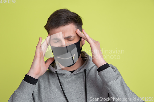 Image of Caucasian man\'s portrait isolated on yellow studio background - freaky model