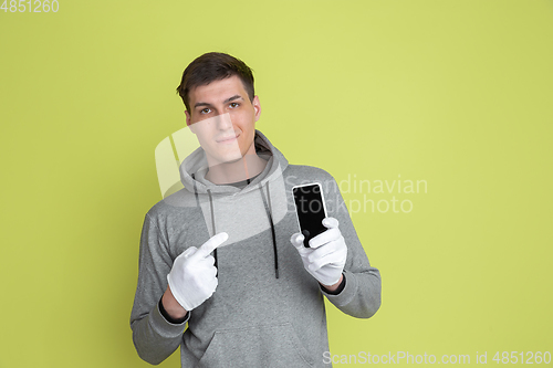 Image of Caucasian man\'s portrait isolated on yellow studio background - freaky model