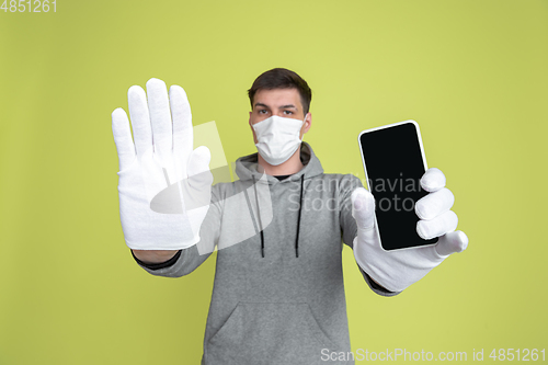 Image of Caucasian man\'s portrait isolated on yellow studio background - freaky model