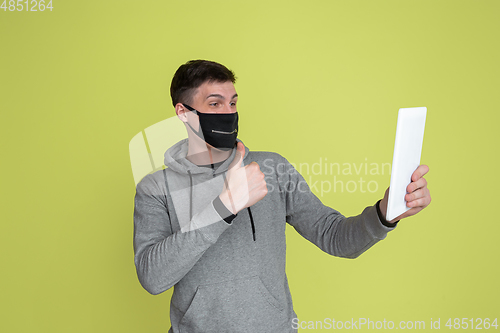 Image of Caucasian man\'s portrait isolated on yellow studio background - freaky model