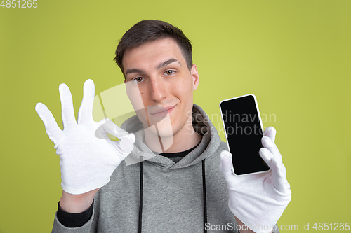 Image of Caucasian man\'s portrait isolated on yellow studio background - freaky model