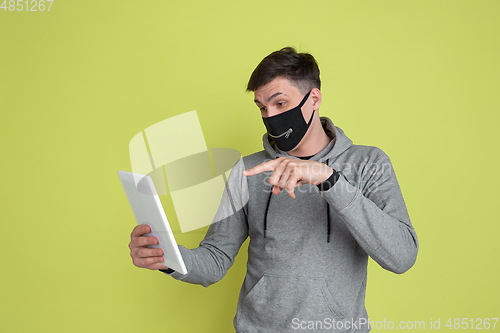 Image of Caucasian man\'s portrait isolated on yellow studio background - freaky model