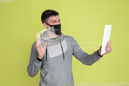 Image of Caucasian man\'s portrait isolated on yellow studio background - freaky model