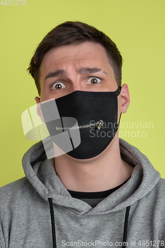 Image of Caucasian man\'s portrait isolated on yellow studio background - freaky model