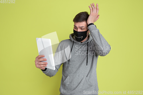 Image of Caucasian man\'s portrait isolated on yellow studio background - freaky model