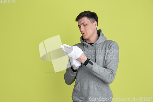 Image of Caucasian man\'s portrait isolated on yellow studio background - freaky model