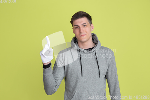 Image of Caucasian man\'s portrait isolated on yellow studio background - freaky model