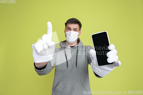 Image of Caucasian man\'s portrait isolated on yellow studio background - freaky model