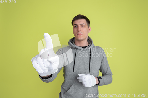 Image of Caucasian man\'s portrait isolated on yellow studio background - freaky model