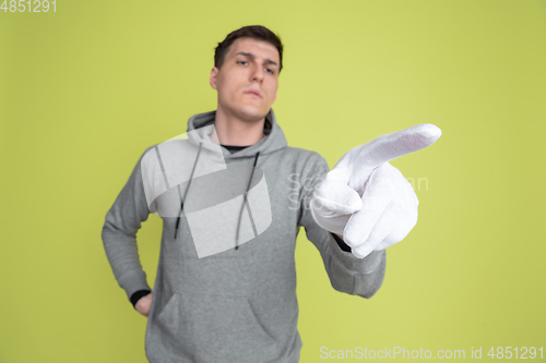 Image of Caucasian man\'s portrait isolated on yellow studio background - freaky model